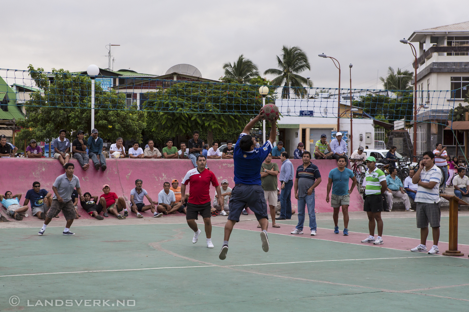 Playing some volley. Santa Cruz, Galapagos. A guy calling his bookie on the right hand side. 

(Canon EOS 5D Mark III / Canon EF 24-70mm f/2.8 L USM)