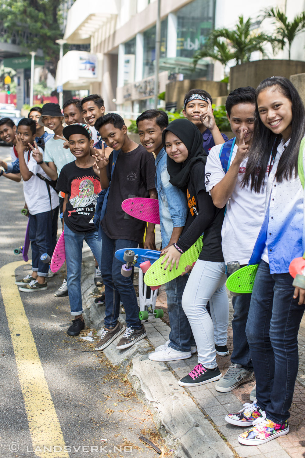 We were walking past a few kids skating in the streets when suddenly they whistled at us. I turned around and they were all lined up for a shot! Kuala Lumpur, Malaysia.

(Canon EOS 5D Mark III / Canon EF 50mm f/1.2 L USM)